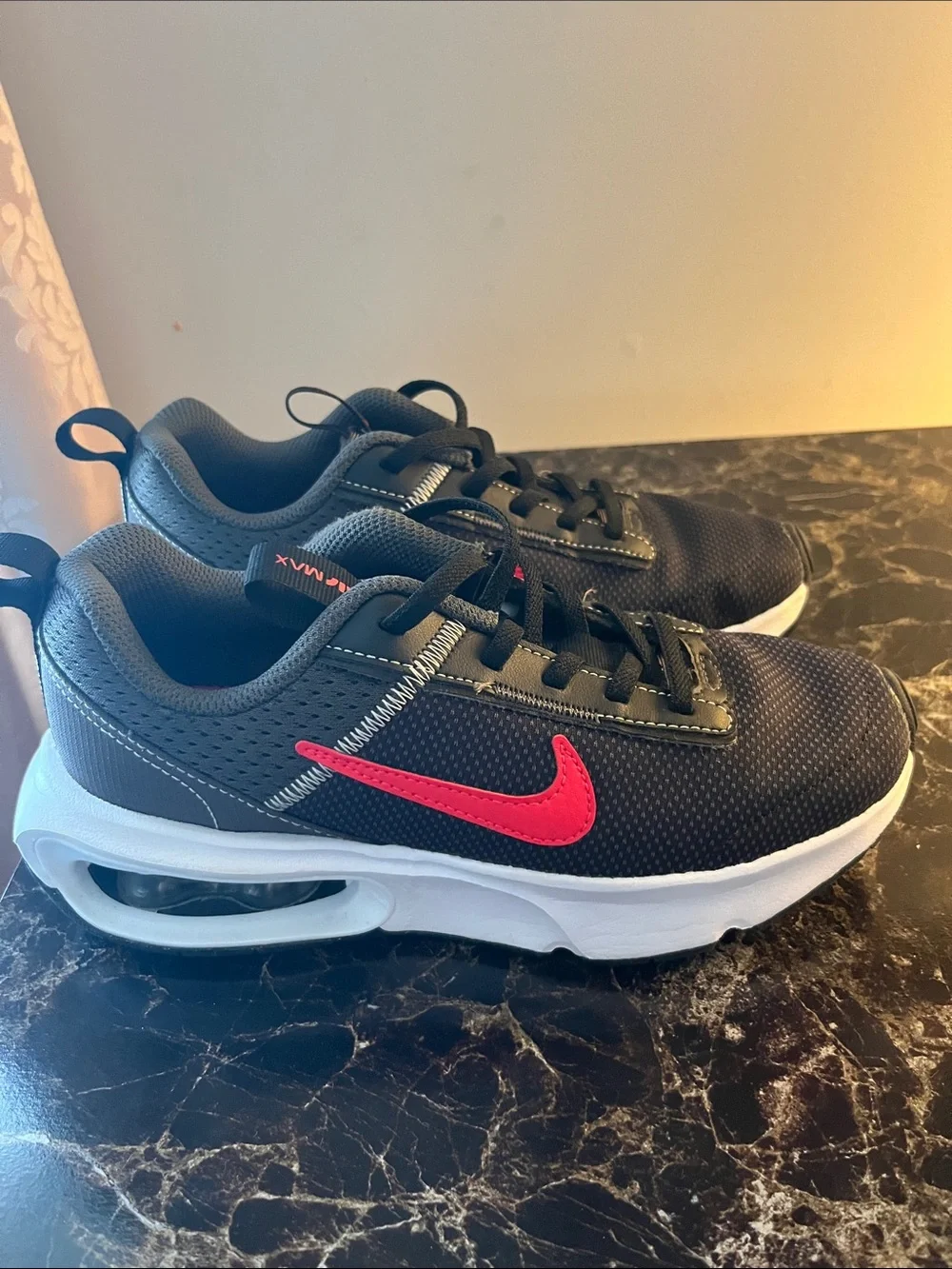 Nike Kids Black Sneakers with Red Swoosh and White Air Sole